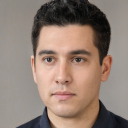 Neutral white young-adult male with short  black hair and brown eyes