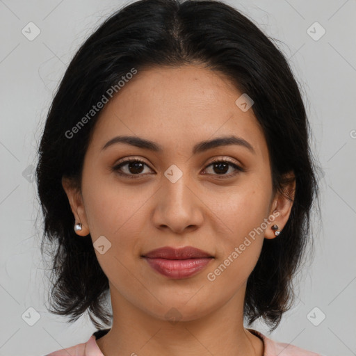 Joyful latino young-adult female with medium  brown hair and brown eyes