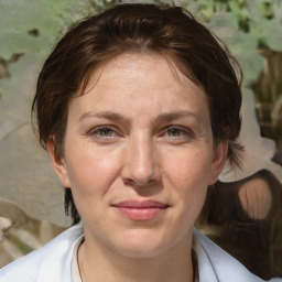 Joyful white adult female with medium  brown hair and brown eyes