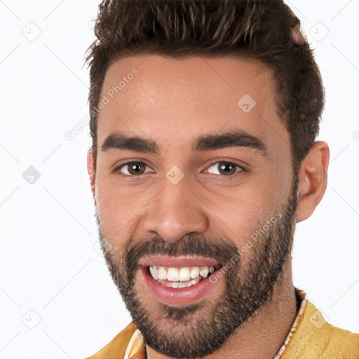 Joyful white young-adult male with short  black hair and brown eyes