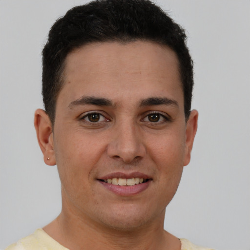 Joyful white young-adult male with short  brown hair and brown eyes