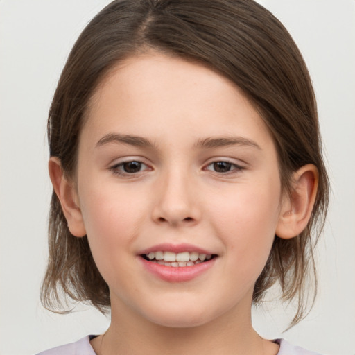 Joyful white child female with medium  brown hair and brown eyes