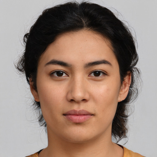 Joyful asian young-adult female with medium  brown hair and brown eyes