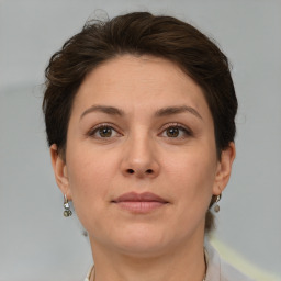 Neutral white adult female with short  brown hair and grey eyes