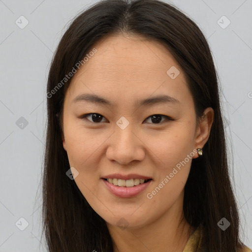 Joyful white young-adult female with long  brown hair and brown eyes