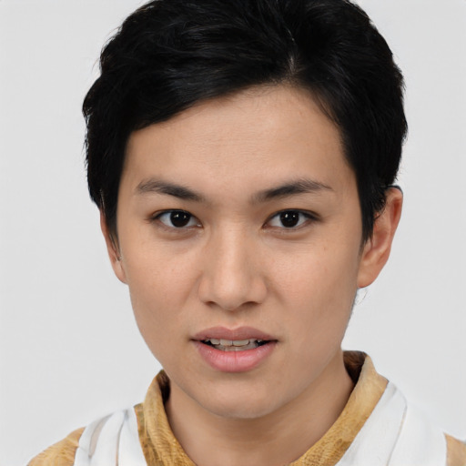 Joyful asian young-adult female with short  brown hair and brown eyes