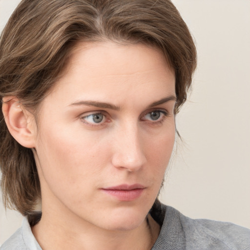 Neutral white young-adult female with medium  brown hair and blue eyes