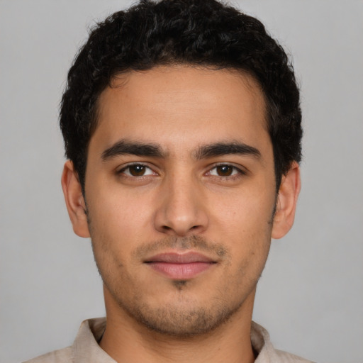 Neutral latino young-adult male with short  brown hair and brown eyes