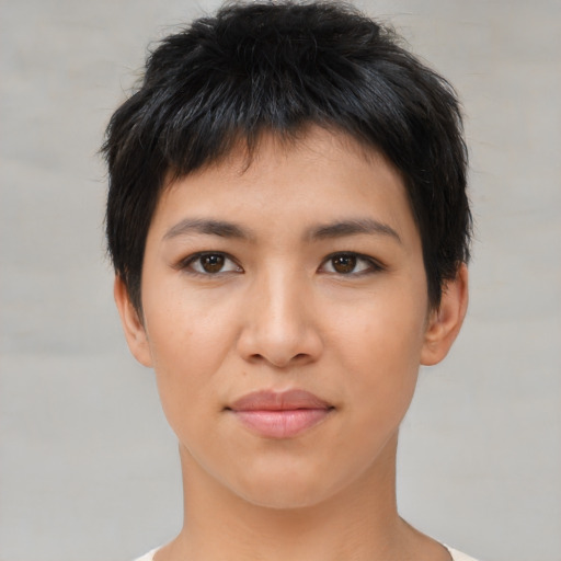 Joyful asian young-adult female with short  black hair and brown eyes