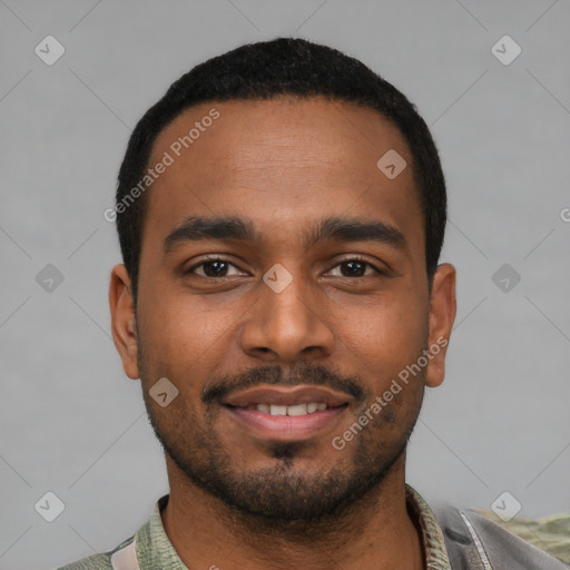 Joyful black young-adult male with short  black hair and brown eyes