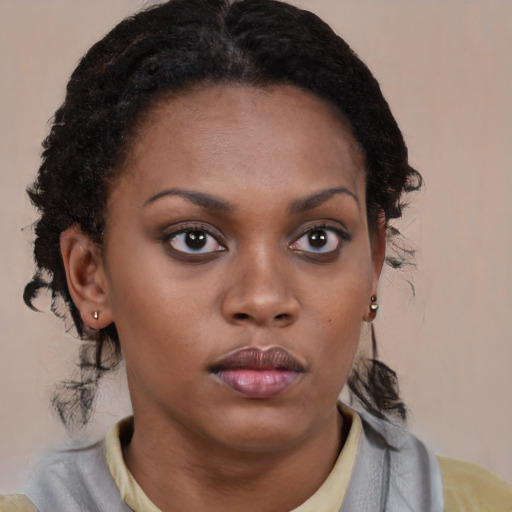 Neutral black young-adult female with medium  brown hair and brown eyes