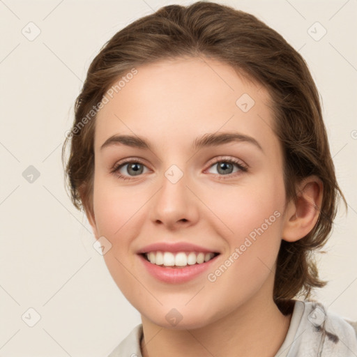 Joyful white young-adult female with medium  brown hair and green eyes