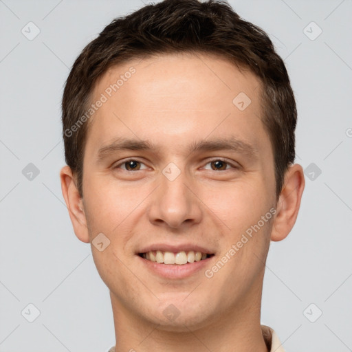 Joyful white young-adult male with short  brown hair and brown eyes