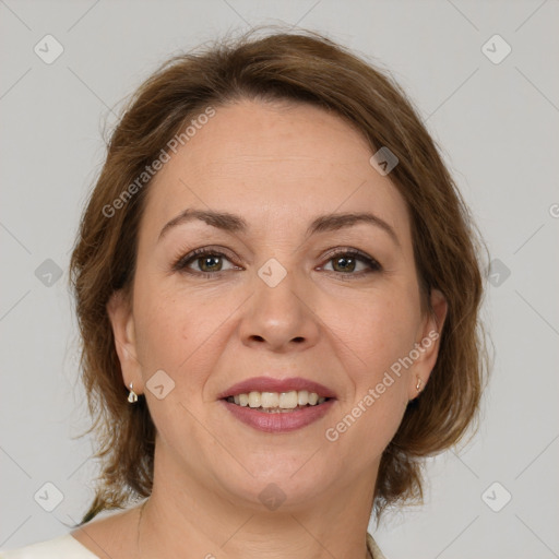 Joyful white adult female with medium  brown hair and brown eyes