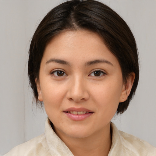 Joyful white young-adult female with medium  brown hair and brown eyes