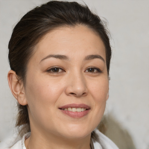 Joyful white young-adult female with medium  brown hair and brown eyes