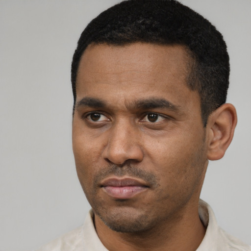 Neutral latino adult male with short  black hair and brown eyes