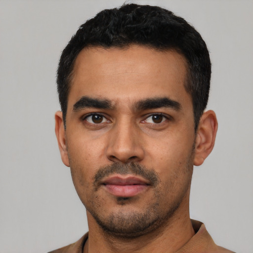 Neutral latino young-adult male with short  black hair and brown eyes