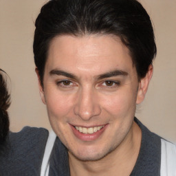 Joyful white young-adult male with medium  brown hair and brown eyes