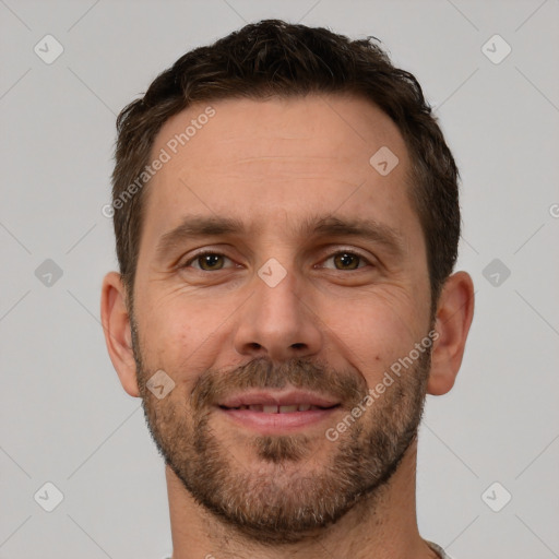 Joyful white adult male with short  brown hair and brown eyes