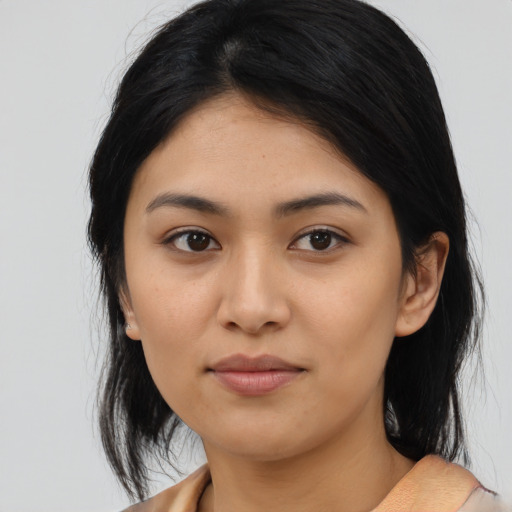 Joyful asian young-adult female with medium  black hair and brown eyes