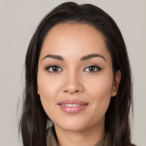 Joyful white young-adult female with long  brown hair and brown eyes