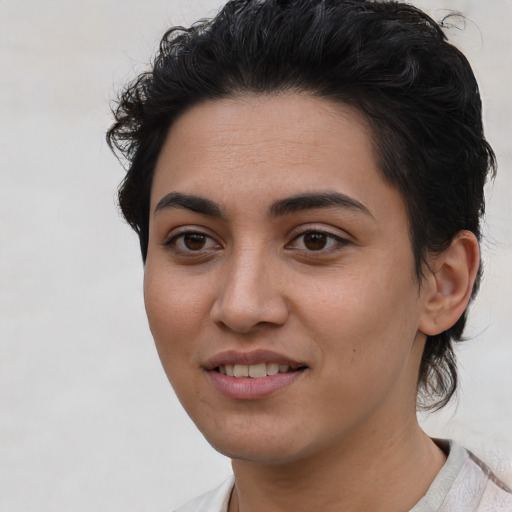 Joyful asian young-adult female with short  brown hair and brown eyes