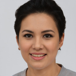 Joyful asian young-adult female with short  brown hair and brown eyes