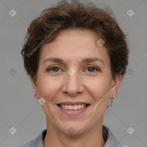 Joyful white adult female with short  brown hair and brown eyes