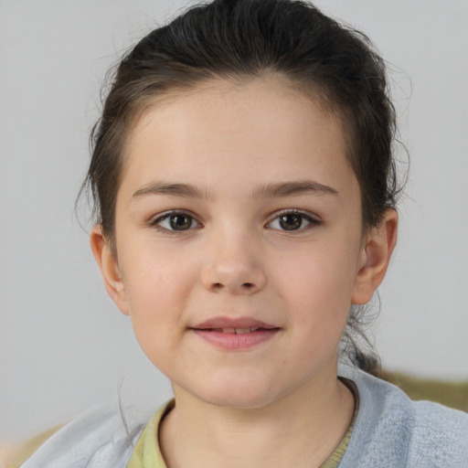 Joyful white child female with short  brown hair and brown eyes