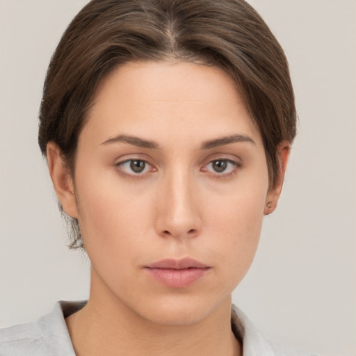 Neutral white young-adult female with short  brown hair and brown eyes