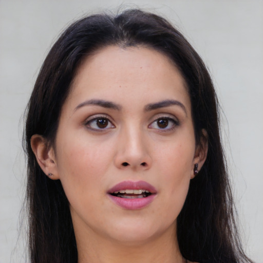 Joyful asian young-adult female with long  brown hair and brown eyes