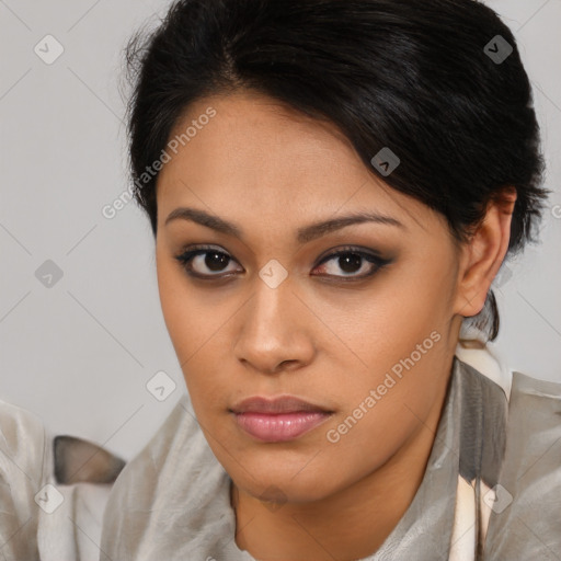 Joyful latino young-adult female with medium  brown hair and brown eyes