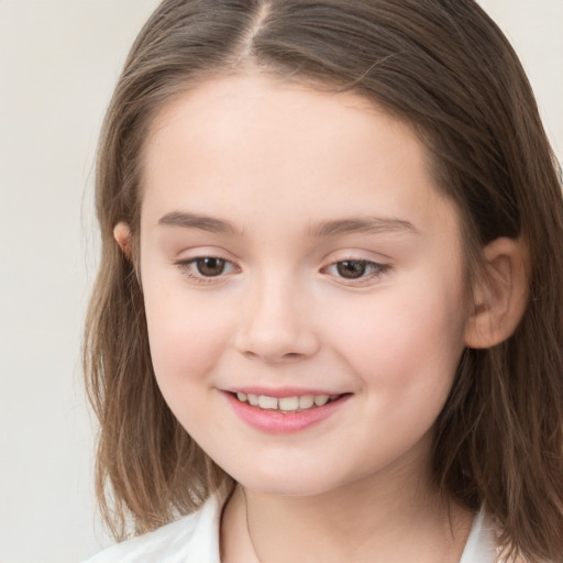 Joyful white child female with medium  brown hair and brown eyes