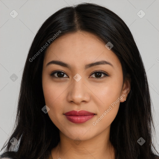 Joyful latino young-adult female with long  brown hair and brown eyes