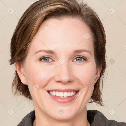 Joyful white adult female with medium  brown hair and grey eyes