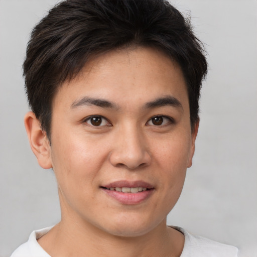 Joyful white young-adult female with short  brown hair and brown eyes