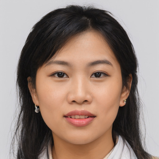 Joyful asian young-adult female with medium  brown hair and brown eyes