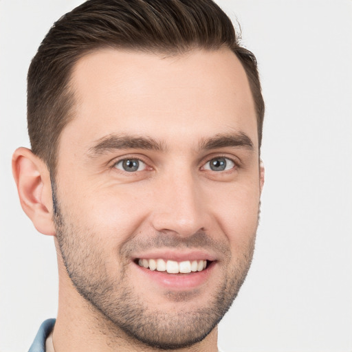 Joyful white young-adult male with short  brown hair and brown eyes