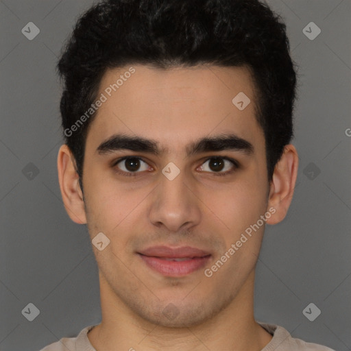 Joyful latino young-adult male with short  brown hair and brown eyes