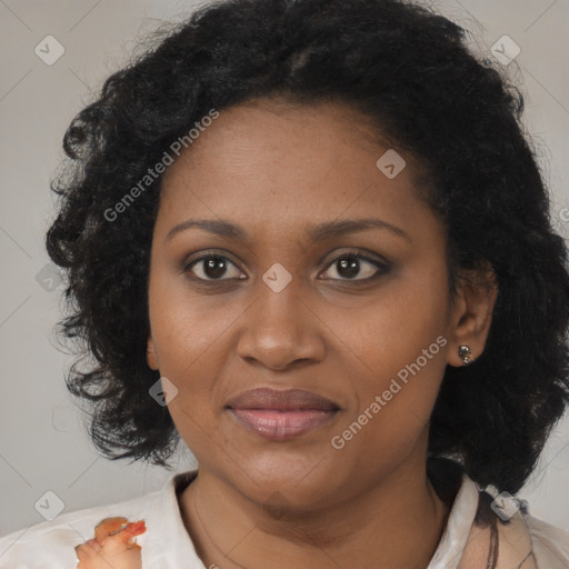 Joyful black adult female with medium  brown hair and brown eyes