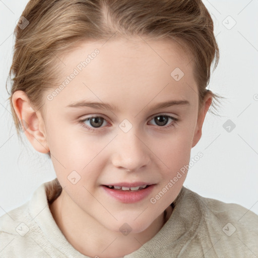 Joyful white child female with short  brown hair and blue eyes