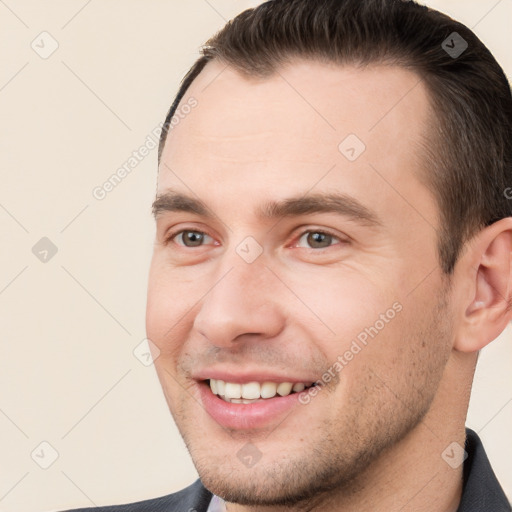 Joyful white young-adult male with short  brown hair and brown eyes