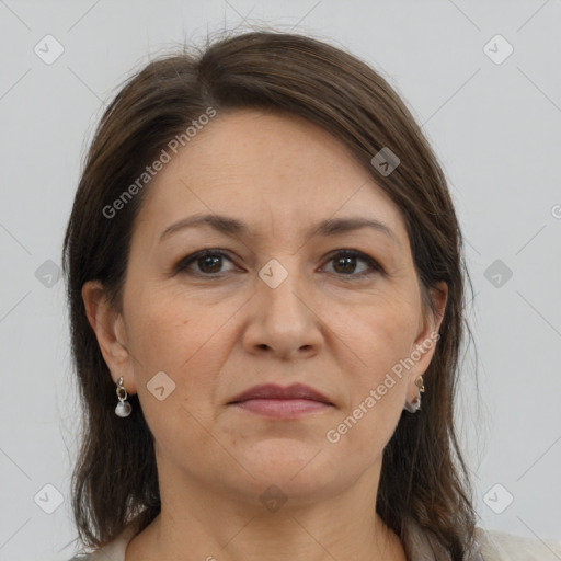 Joyful white adult female with medium  brown hair and brown eyes