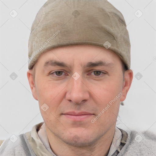 Joyful white young-adult male with short  brown hair and blue eyes