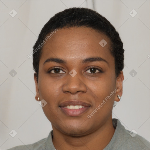 Joyful black young-adult female with short  black hair and brown eyes