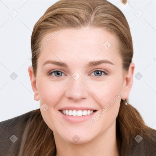 Joyful white young-adult female with long  brown hair and grey eyes