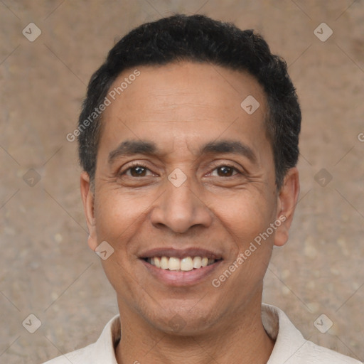 Joyful latino adult male with short  black hair and brown eyes