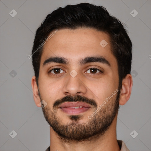 Joyful latino young-adult male with short  black hair and brown eyes