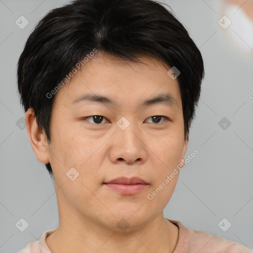 Joyful asian young-adult male with short  brown hair and brown eyes